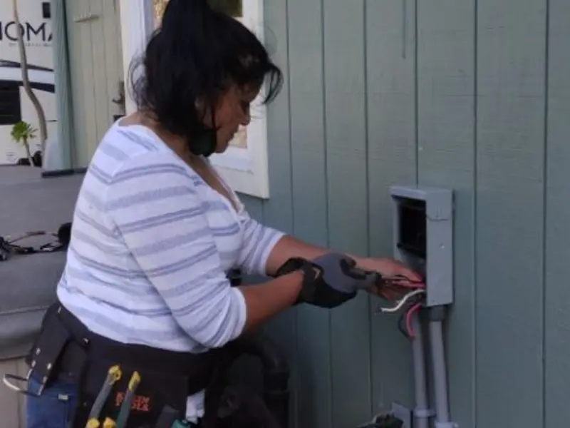 Licensed electrician wiring an exterior subpanel in Kachina Village