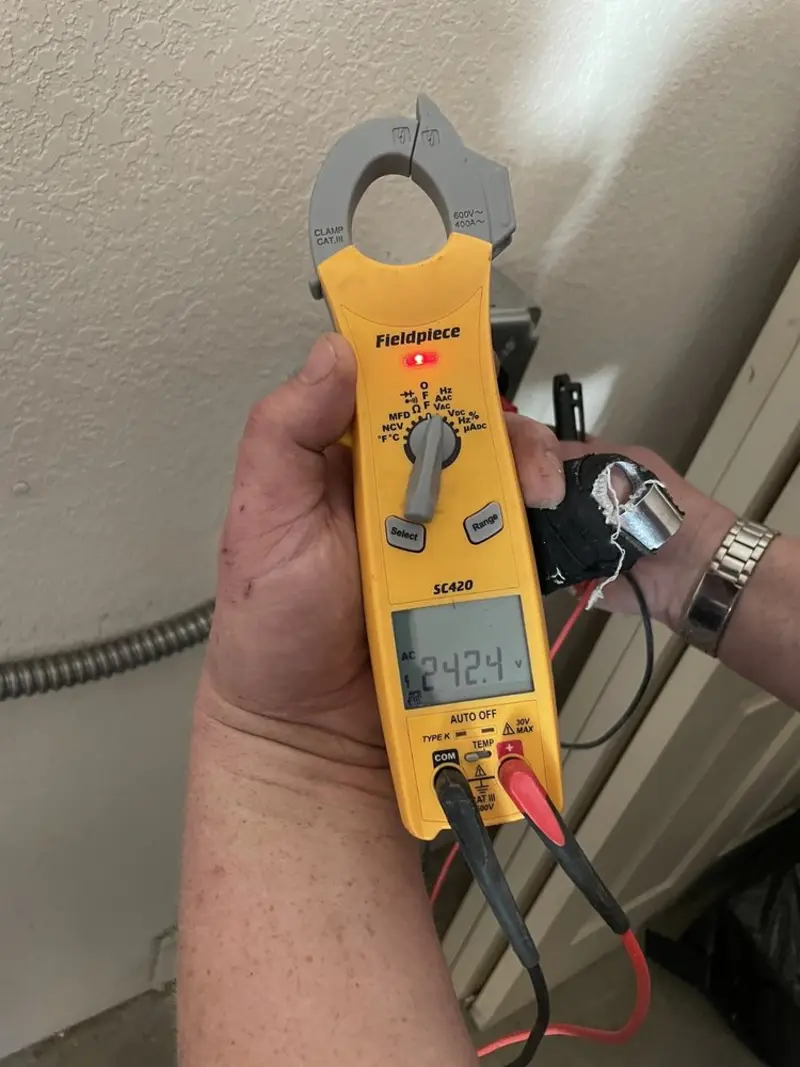 Voltage testing with clamp meter during Electrical Installation Services in Kachina Village